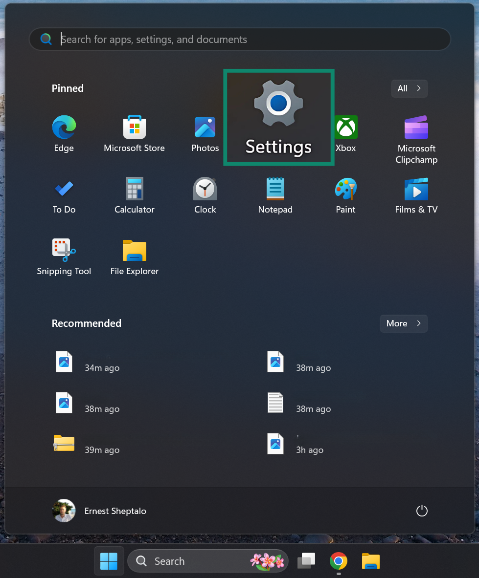 Press on the Windows icon and select the Setttings menu.