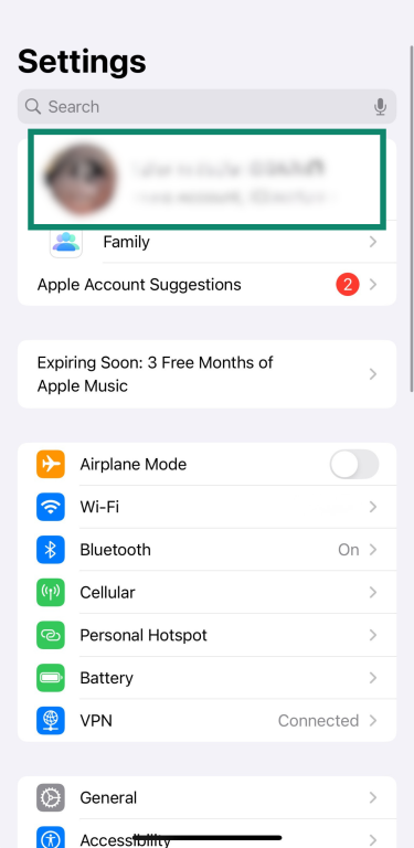 iPhone Settings screen highlighting Apple ID at the top of the menu.