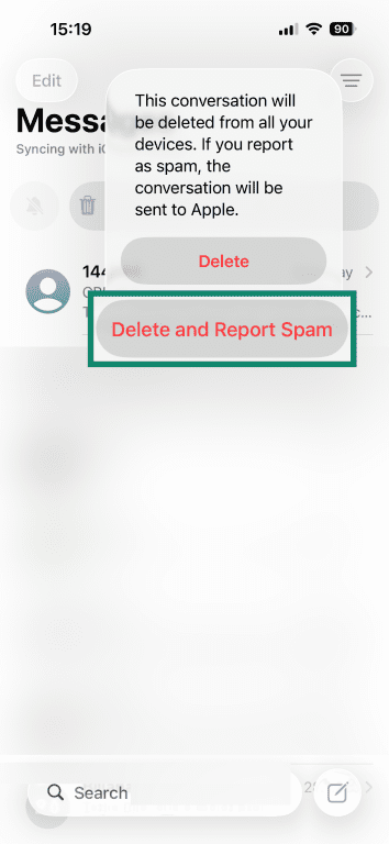 How to report a phishing text on iPhone via the "Report Spam" button.